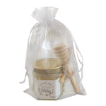Cadeau Joyeuses Fêtes avec mini pot de miel artisanal personnalisé, cuillère à miel en bois, breloque abeille et pochette organza prête à offrir.