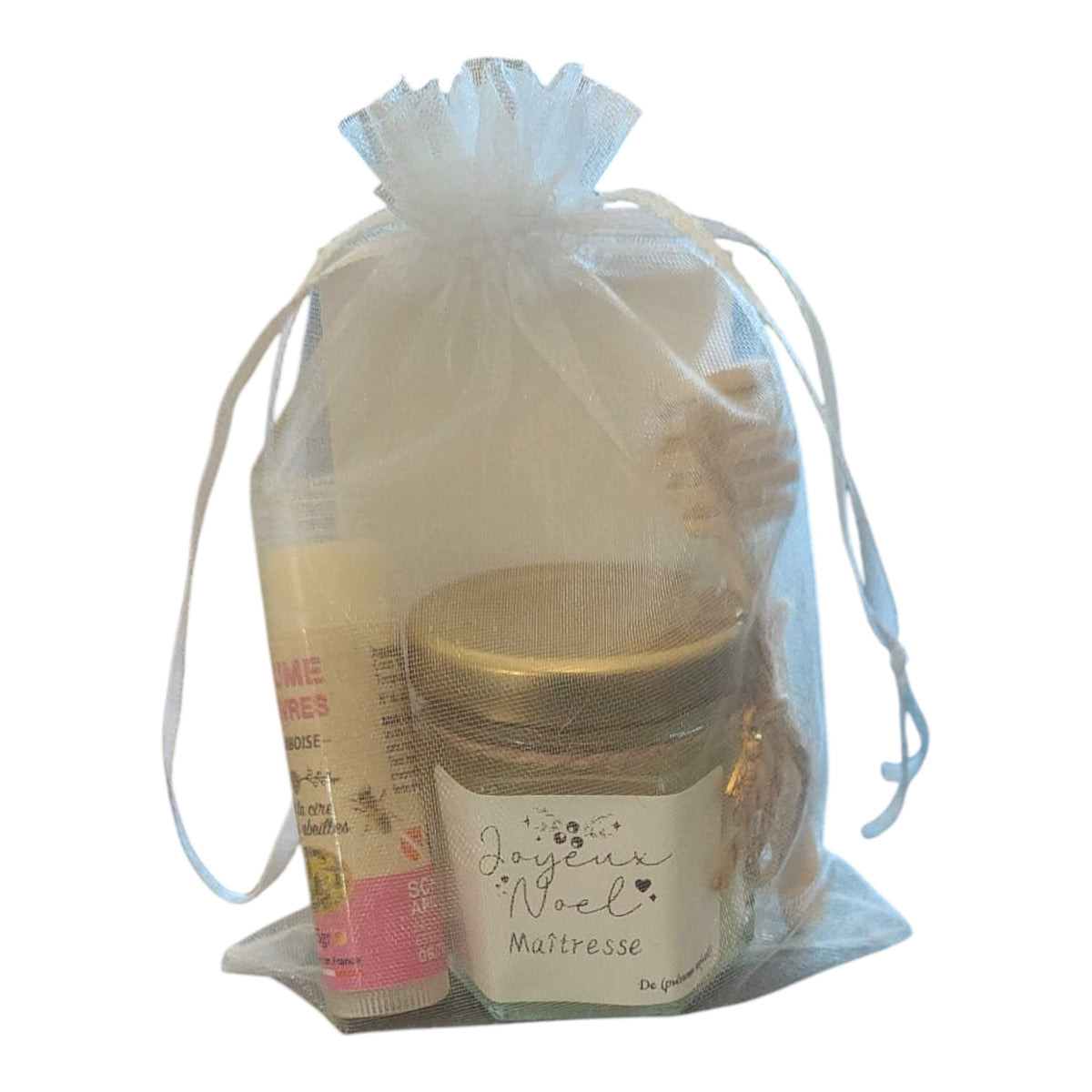 Cadeau de Noël personnalisé pour maîtresse comprenant un mini pot de miel artisanal, un baume à lèvres à la cire de nos abeilles parfum framboise, une cuillère à miel en bois, une breloque abeille et une étiquette « Joyeux Noël Maîtresse ».
