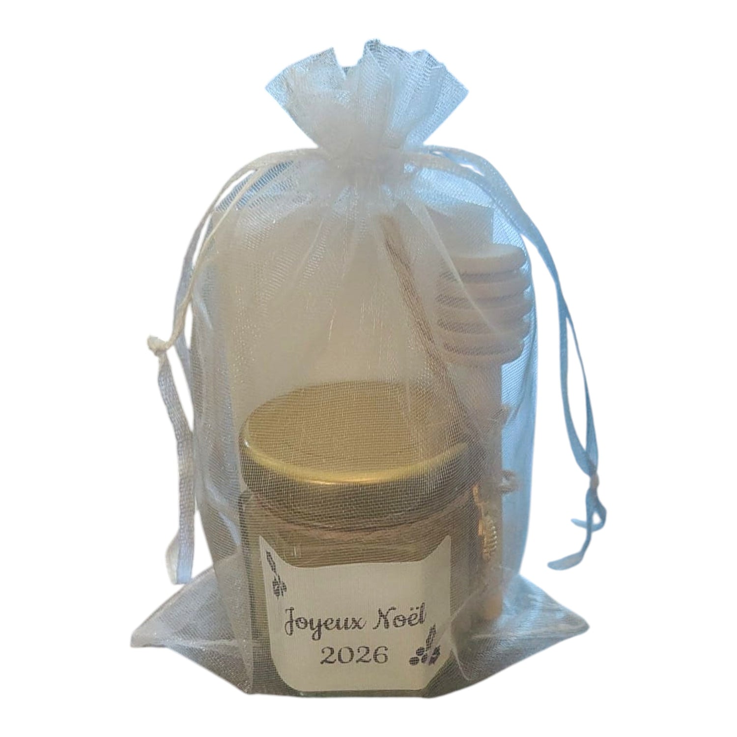 Cadeau de Noël personnalisé avec mini pot de miel artisanal, étiquette Joyeux Noël 2026, cuillère à miel en bois, breloque abeille dorée et pochon en organza prêt à offrir.