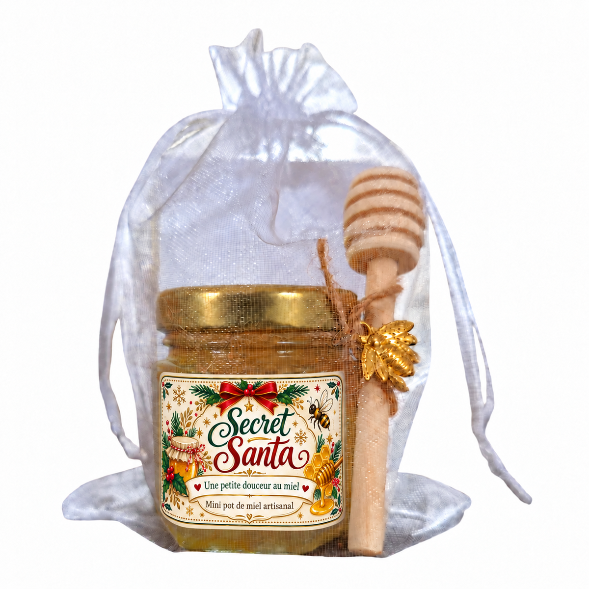 Cadeau Secret Santa avec mini pot de miel artisanal, étiquette personnalisée de Noël, cuillère à miel en bois et abeille dorée, présenté dans un sachet organza blanc.