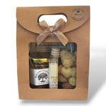 Coffret baptême personnalisé avec prénom contenant miel de la ruche, bougie ange et baume à lèvres naturel