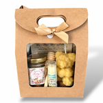 Coffret cadeau baptême personnalisé avec miel, baume à lèvres et bougie en cire d’abeille