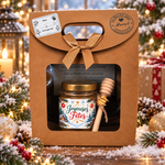 Coffret cadeau de fin d’année avec miel artisanal présenté dans une ambiance hivernale festive