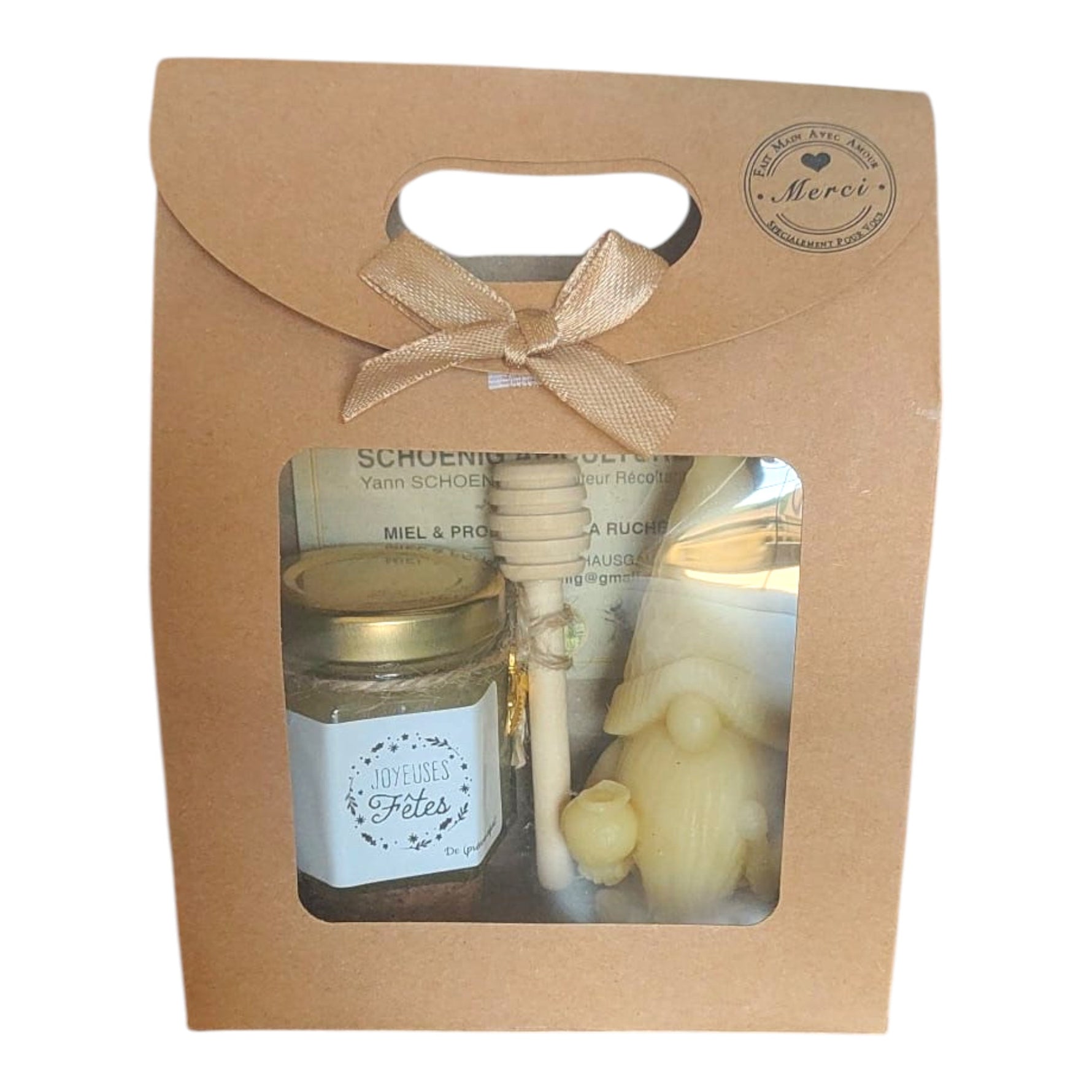 Coffret cadeau artisanal avec étiquette Joyeuses Fêtes, pot de miel, bougie en cire d'abeille et cuillère à miel.