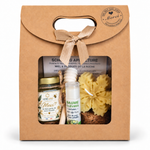 Coffret cadeau personnalisé avec pot de miel artisanal français, étiquette Merci, bougie flocon en cire d'abeille, baume à lèvres naturel et cuillère à miel en bois.