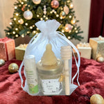 Cadeau de Noël personnalisé composé d'un mini pot de miel, d'un baume à lèvres artisanal, d'une bougie en cire d'abeille et d'une cuillère à miel, idéal pour un cadeau de fin d'année ou de remerciement.