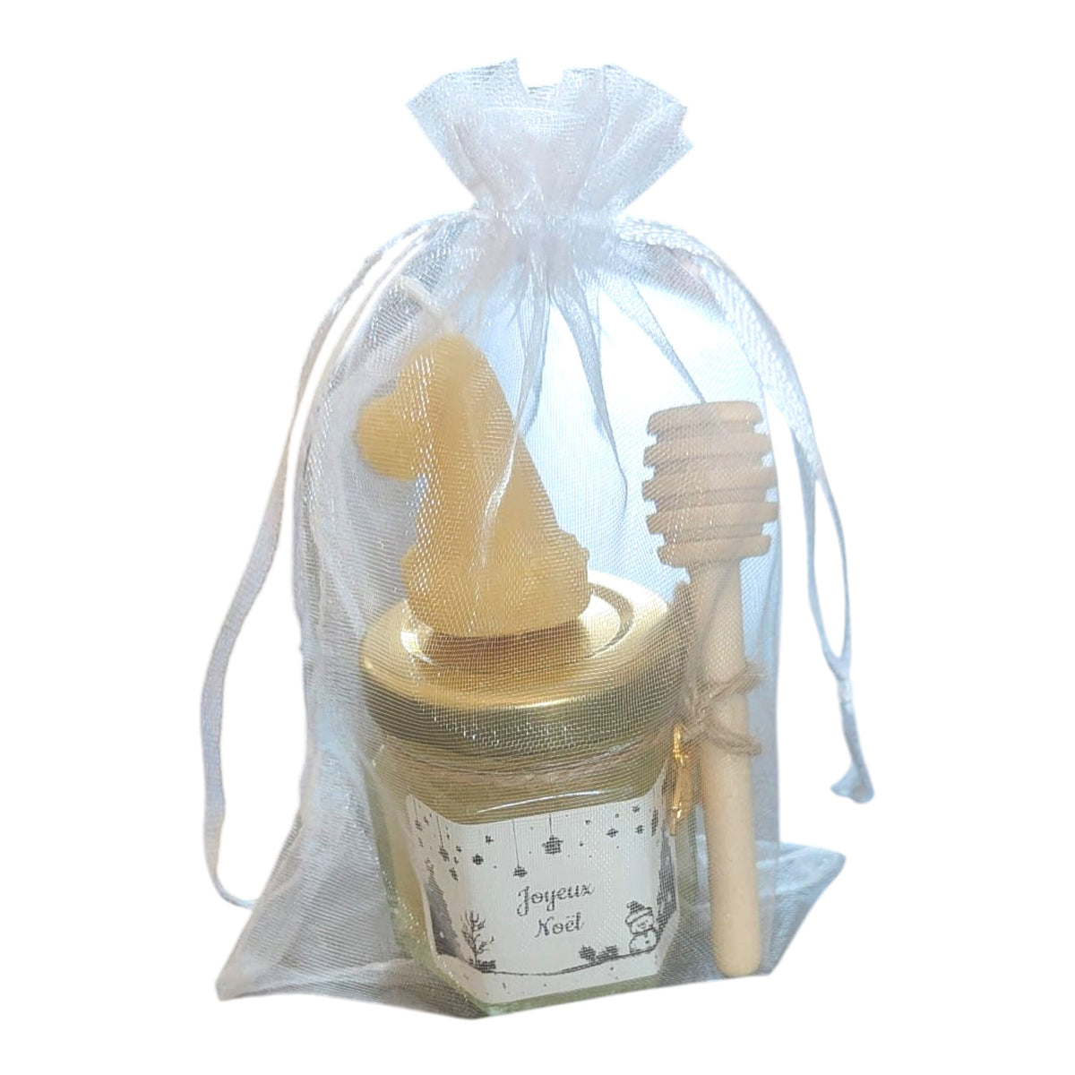 Coffret cadeau de Noël artisanal composé d'un mini pot de miel, d'une bougie en cire d'abeille et d'une cuillère à miel.
