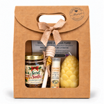 Coffret cadeau de Noël avec mini pot de miel artisanal personnalisé, bougie pomme de pin en cire d’abeille, baume à lèvres et cuillère à miel.
