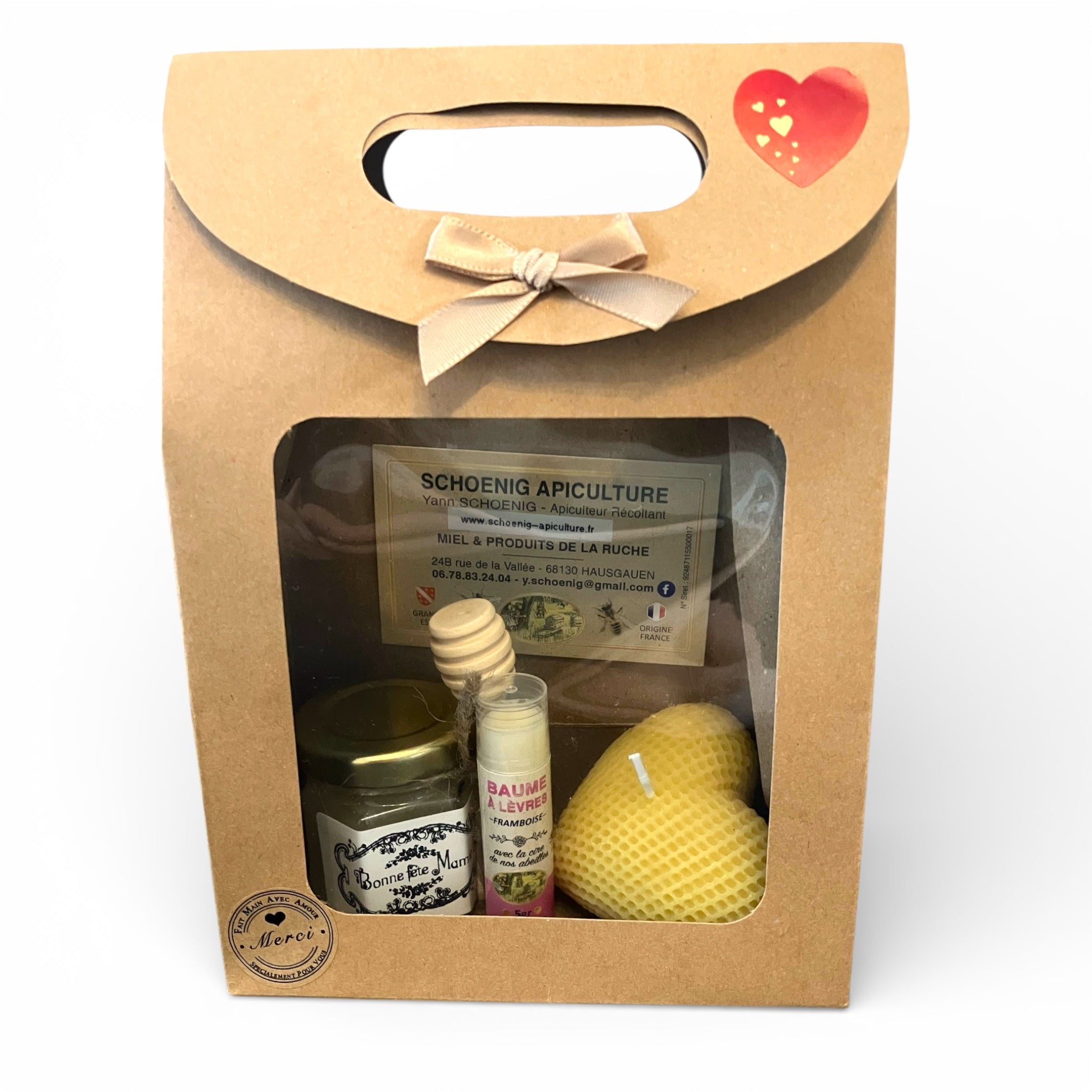 Coffret cadeau bonne fête avec miel artisanal personnalisé, baume à lèvres et bougie en cire d’abeille dans boîte kraft fenêtre transparente