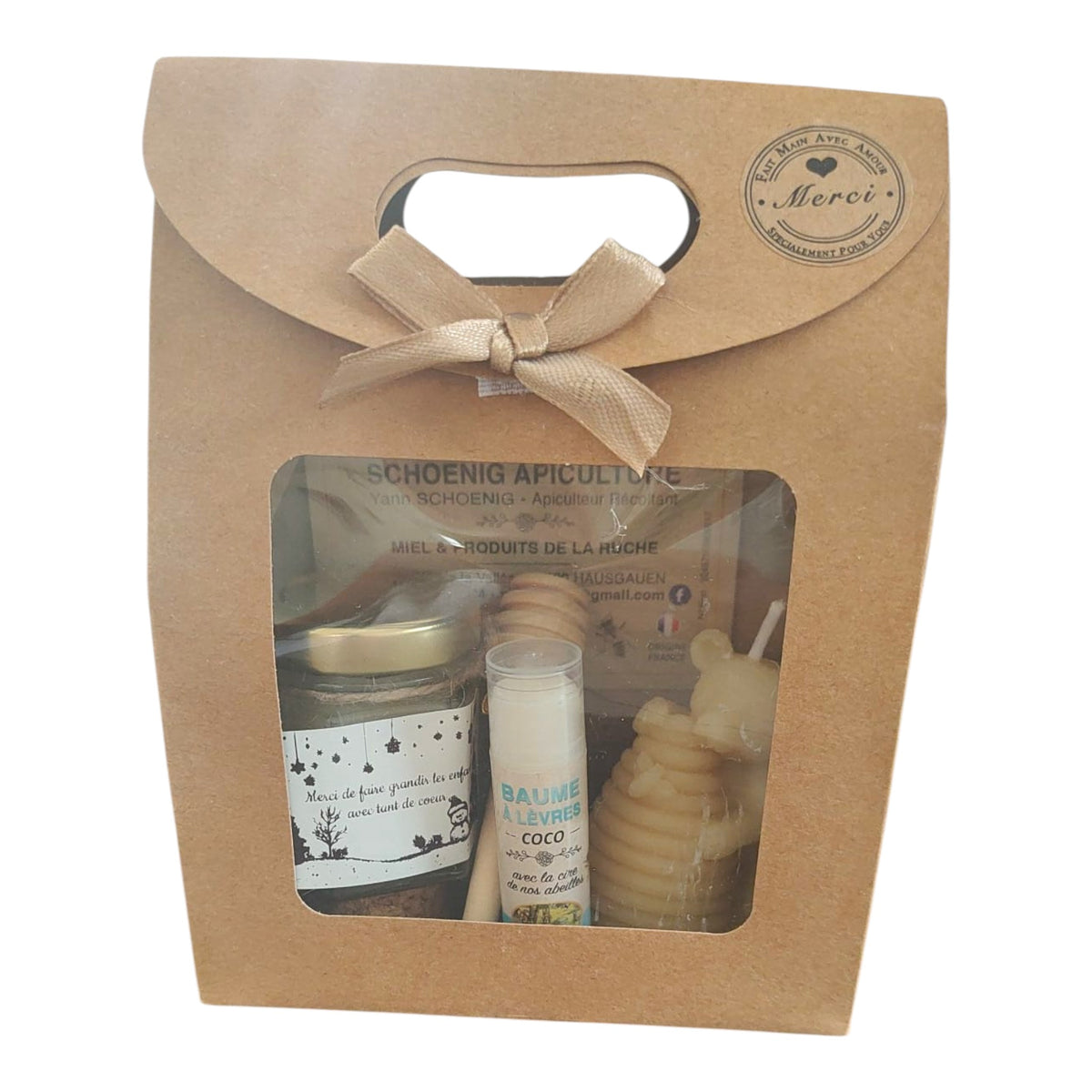 Coffret cadeau avec miel, baume coco, bougie ruche et étiquette Merci de faire grandir les enfants avec tant de cœur.