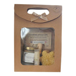 Coffret miel personnalisé avec baume à lèvres à la cire d’abeille et bougie flocon, cadeau client, collaborateur ou CSE de fin d’année présenté dans un coffret kraft avec fenêtre transparente