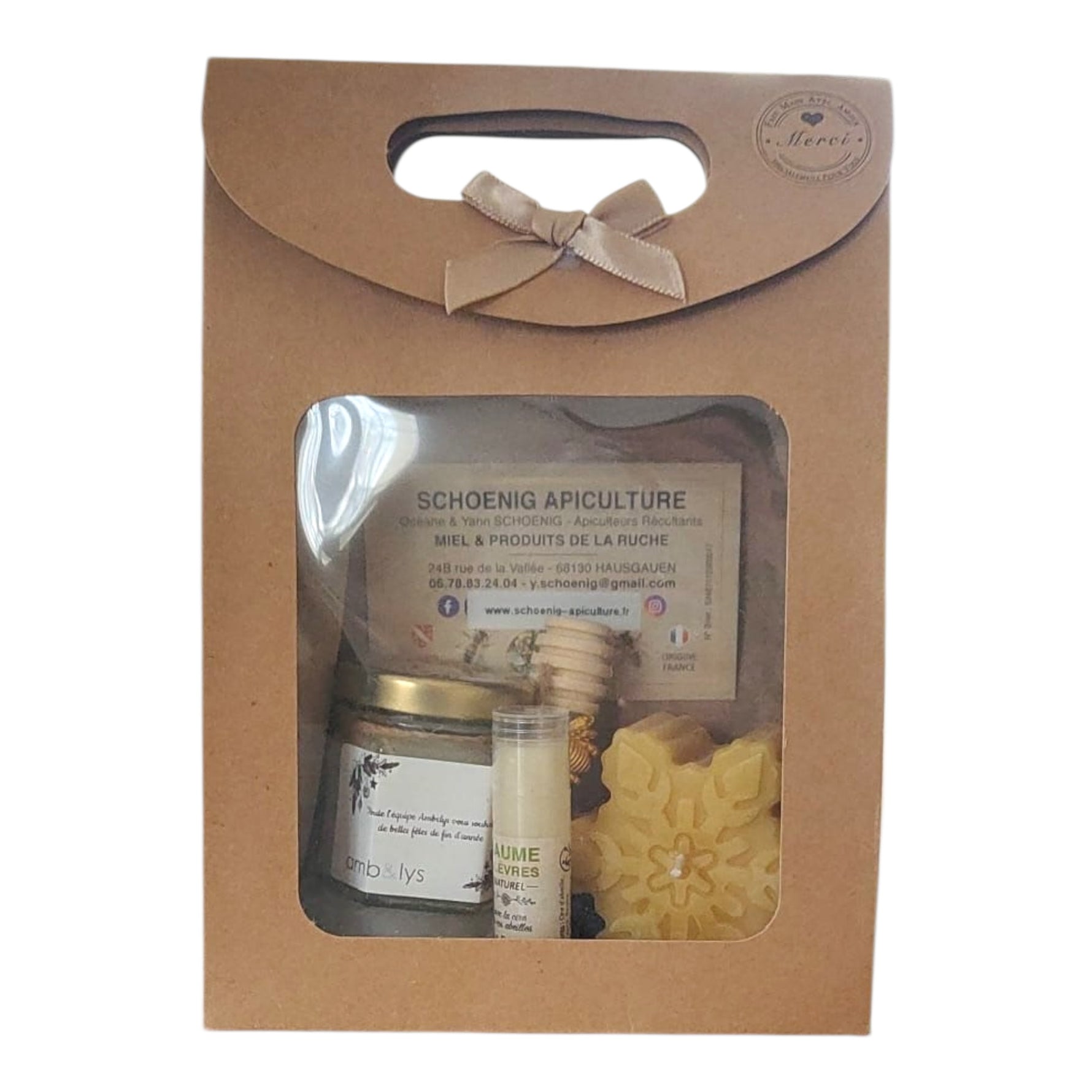 Coffret miel personnalisé avec baume à lèvres à la cire d’abeille et bougie flocon, cadeau client, collaborateur ou CSE de fin d’année présenté dans un coffret kraft avec fenêtre transparente