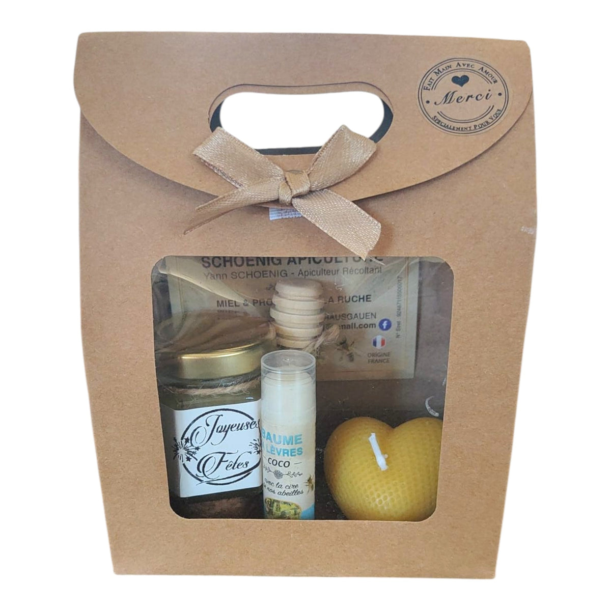 Coffret cadeau Noël avec miel, baume coco, bougie cœur et étiquette Joyeuses Fêtes.