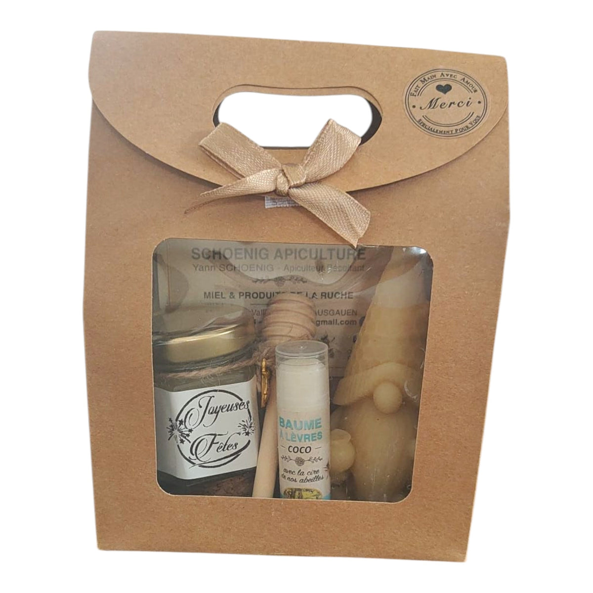 Coffret cadeau artisanal avec miel, baume coco, bougie lutin en cire d'abeille et étiquette Joyeuses Fêtes.