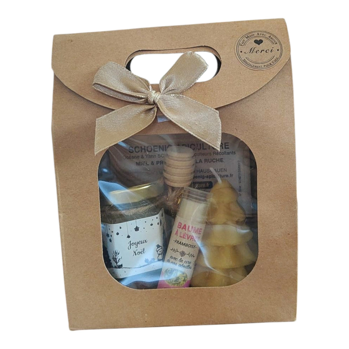Coffret cadeau Noël avec miel, baume coco, bougie sapin et étiquette Joyeux Noël.