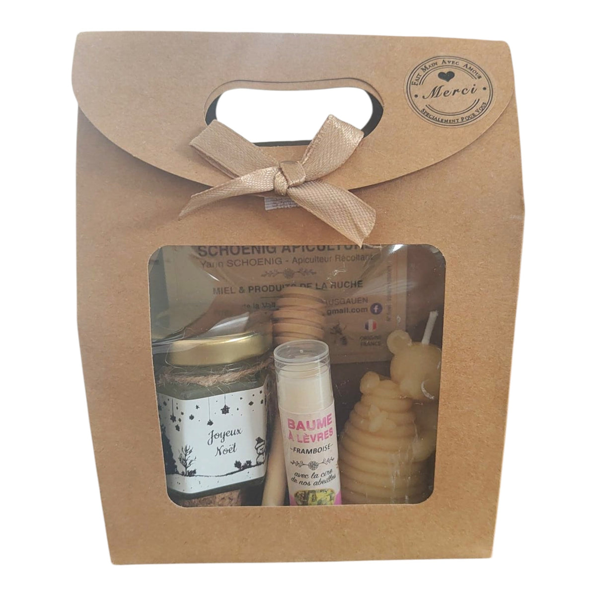 Coffret cadeau Noël avec miel, baume framboise, bougie ruche en cire d'abeille et étiquette Joyeux Noël.