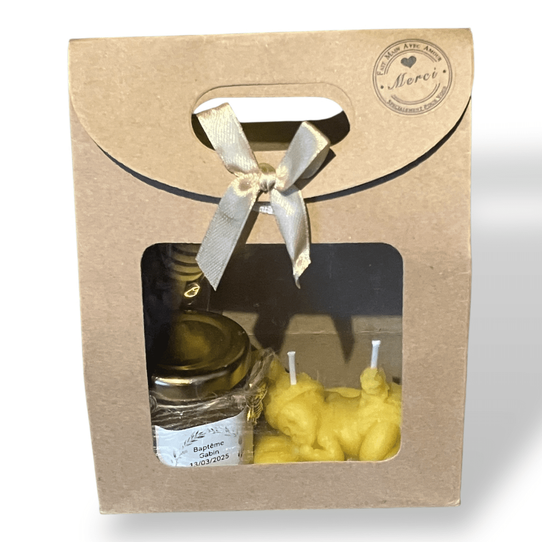 Détail coffret cadeau avec pot de miel artisanal et bougie en cire d’abeille naturelle, fabrication artisanale issue de ruches locales