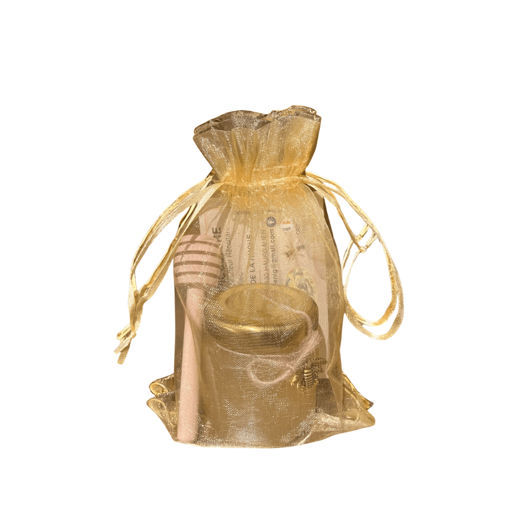 Petit pot de miel pour cadeau entreprise avec cuillère à miel présenté dans un sachet organza doré