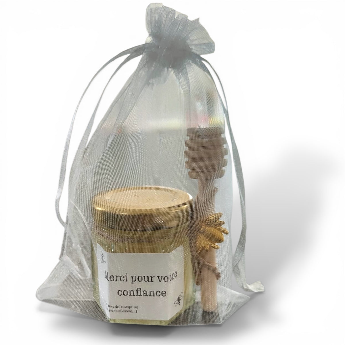 petit pot de miel personnalisé dans un sac organza, avec sa cuillère en bois et breloque abeille cadeau client entreprise